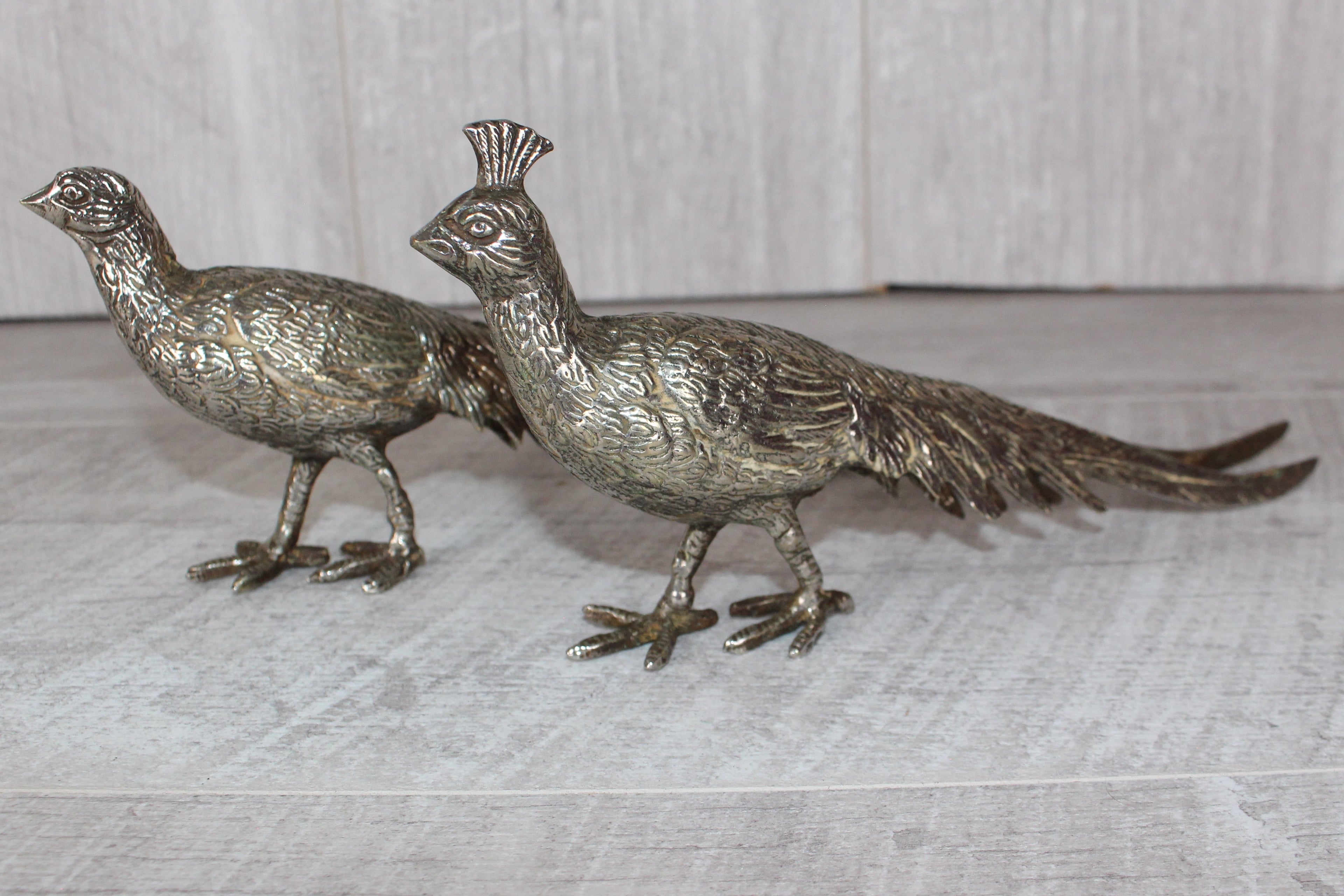 A Pair of Silver Plated Peacocks - Male and Female 10" length