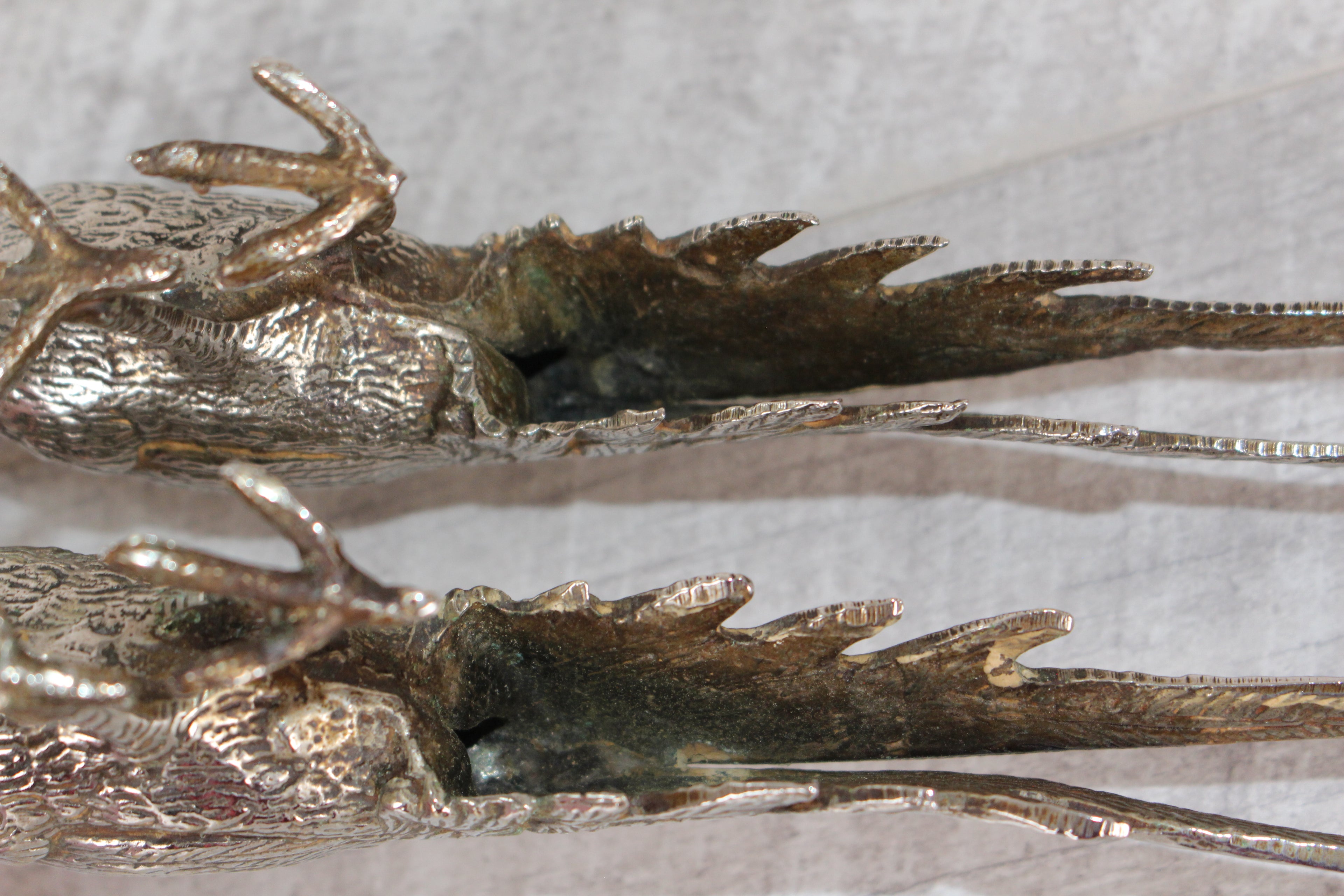 A Pair of Silver Plated Peacocks - Male and Female 10" length