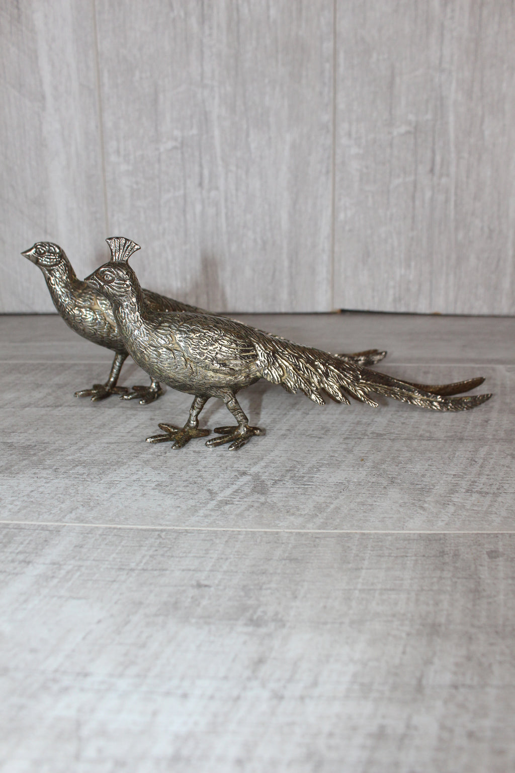 A Pair of Silver Plated Peacocks - Male and Female 10" length