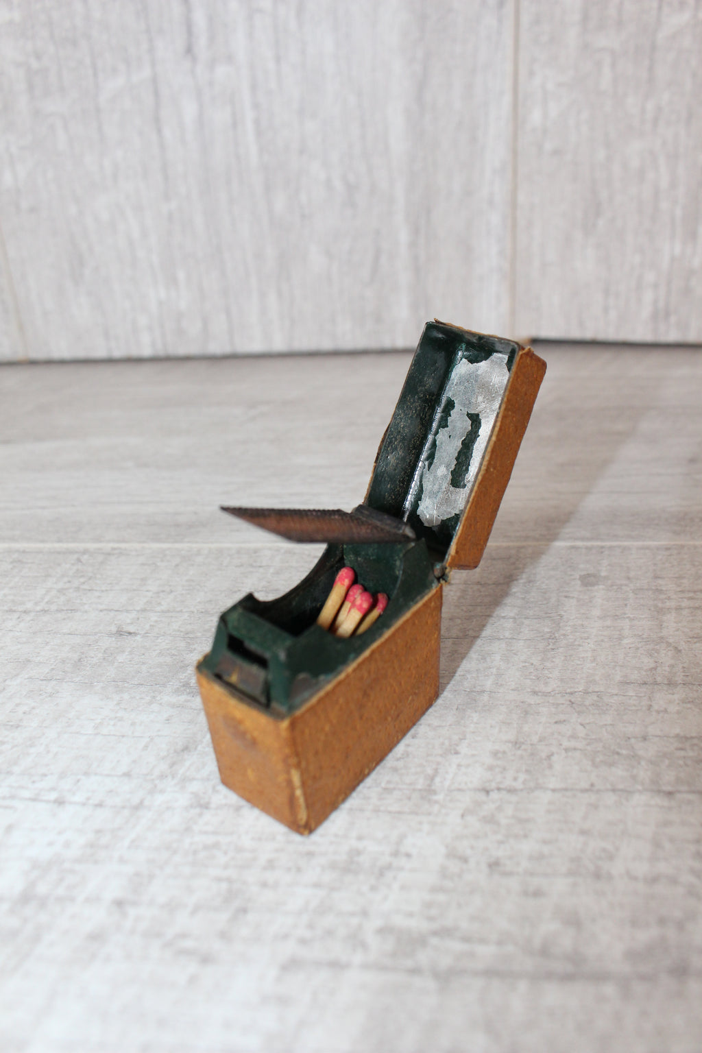 Edwardian metal leatherette covered vesta case, original matches