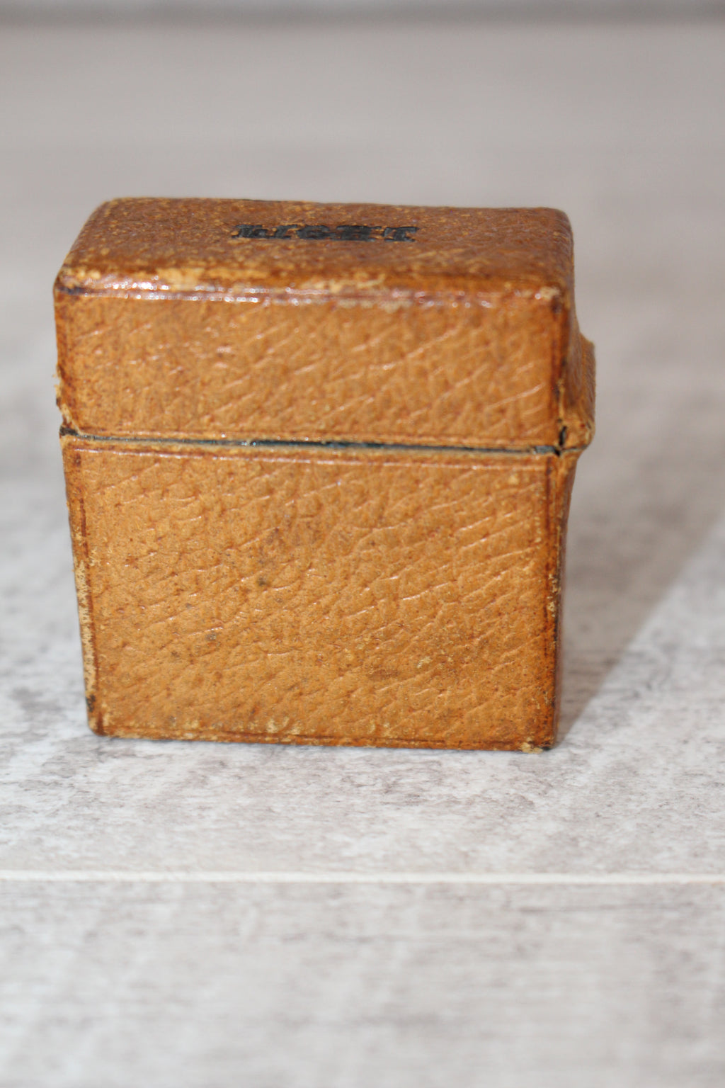 Edwardian metal leatherette covered vesta case, original matches