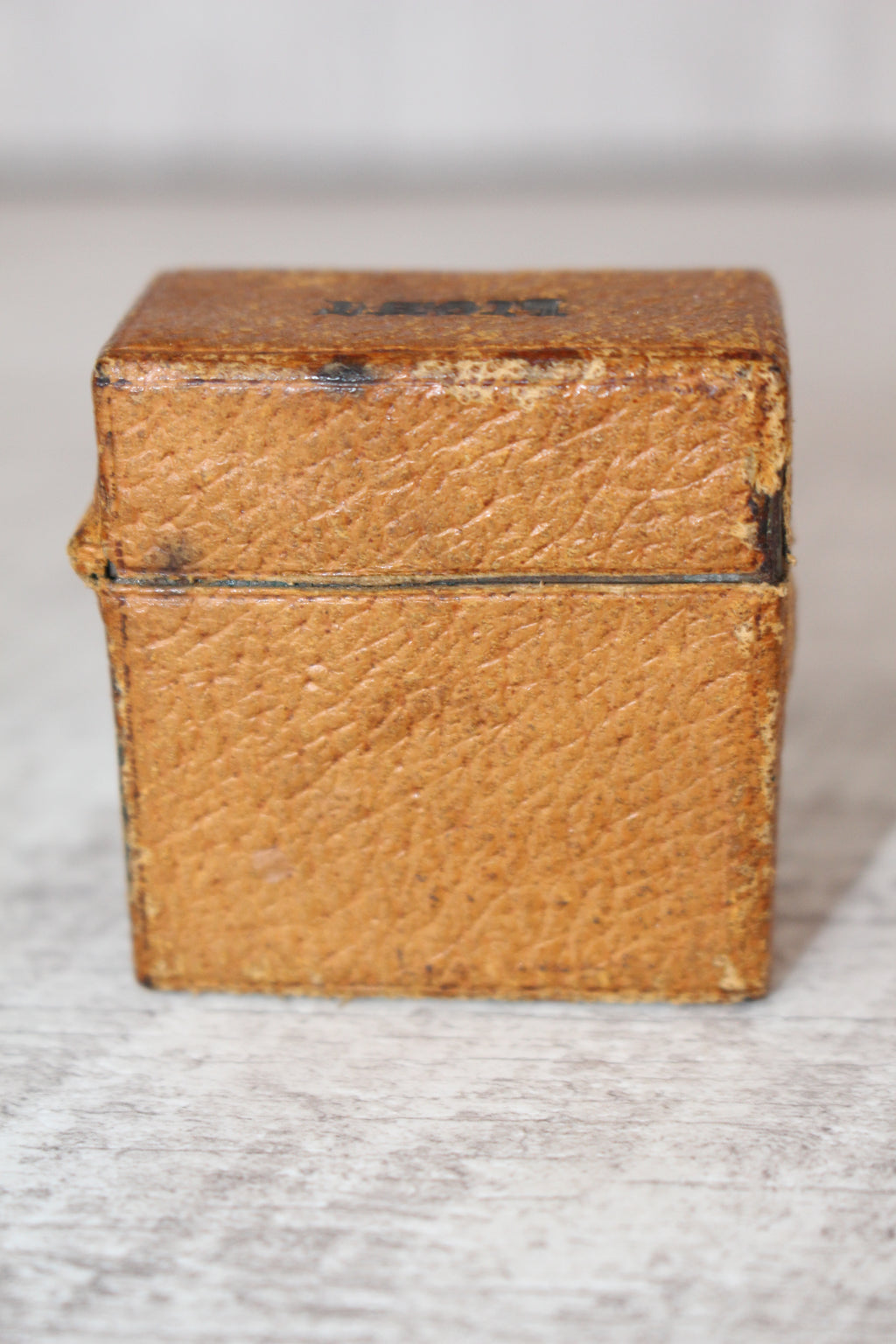 Edwardian metal leatherette covered vesta case, original matches