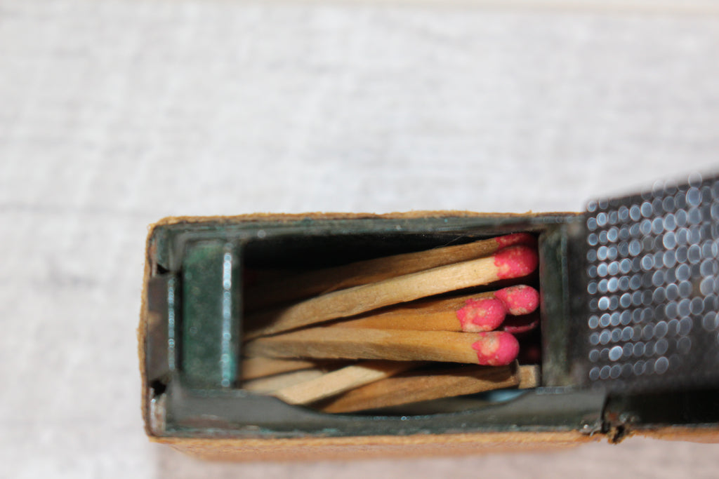 Edwardian metal leatherette covered vesta case, original matches