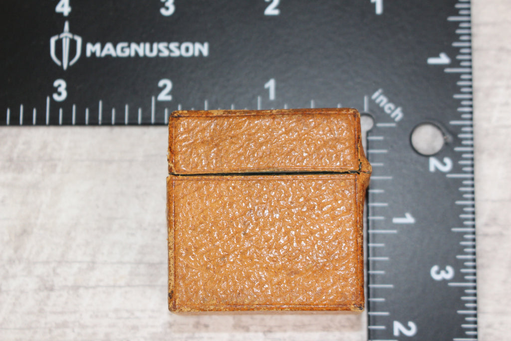 Edwardian metal leatherette covered vesta case, original matches