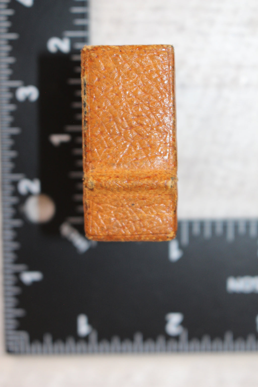 Edwardian metal leatherette covered vesta case, original matches